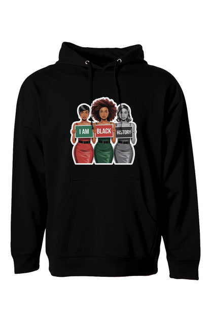 A black midweight hoodie featuring a striking digital illustration of three Black women in bold outfits holding signs that read "I AM BLACK HISTORY." The center woman is in full color, while the figures on the sides are partially desaturated. The hoodie includes a front pocket and drawstring hood, available in four colors and sizes XS-3XL.