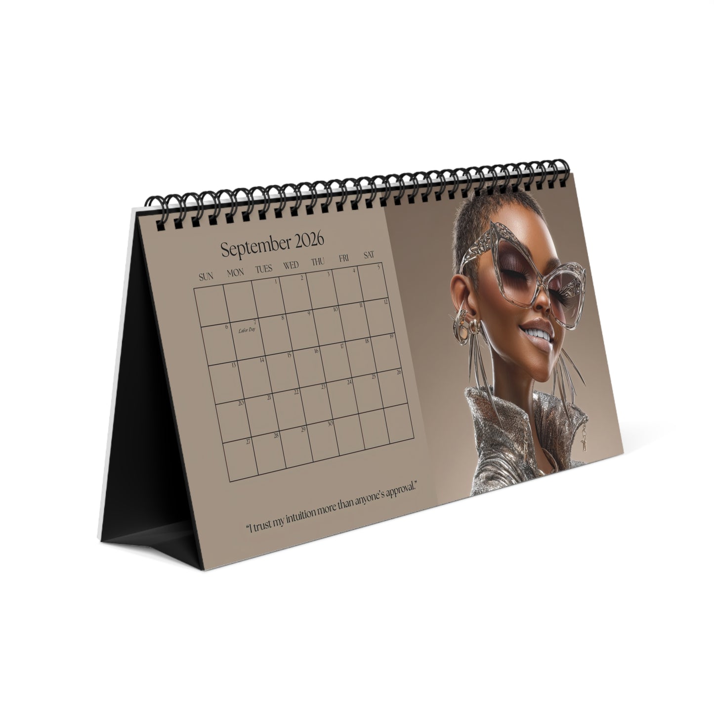 Black Girl Luxe 2026 desktop calendar cover featuring a stylish Black woman with natural hair, oversized glasses, and luxury fashion on brown background.