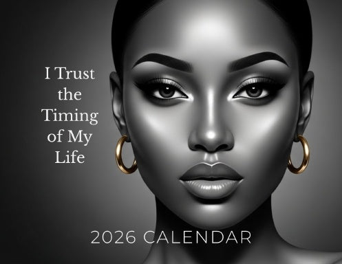 2026 inspirational wall calendar cover featuring elegant black and white portrait of a confident Black woman with gold hoop earrings and calm expression